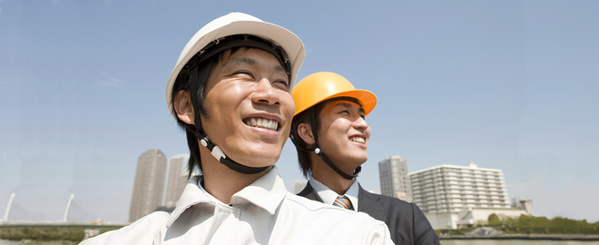 two construction industry businessmen looking out