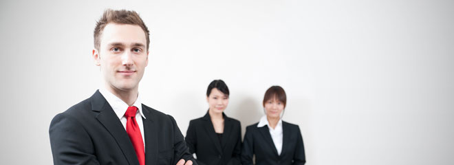 Western teacher and two Japanese females in background